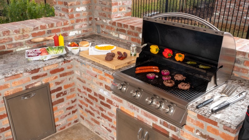 Food cooking in Chris Hurt's outdoor kitchen