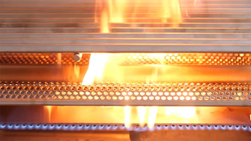 closeup of the burners, flame tamers, and grill grates of the Blaze BCM Gas Grill