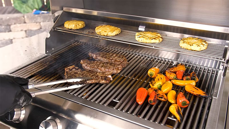 Cooking steaks and peppers on the Blaze BCM Gas Grill