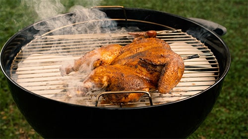 Spatchcocked chicken on a charcoal grill