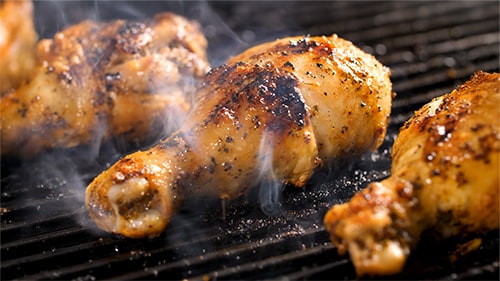chicken wings on a charcoal grill