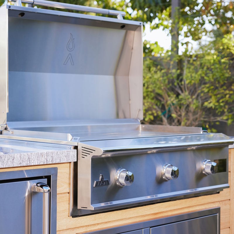 Blaze stainless steel gas griddle built into an outdoor kitchen island