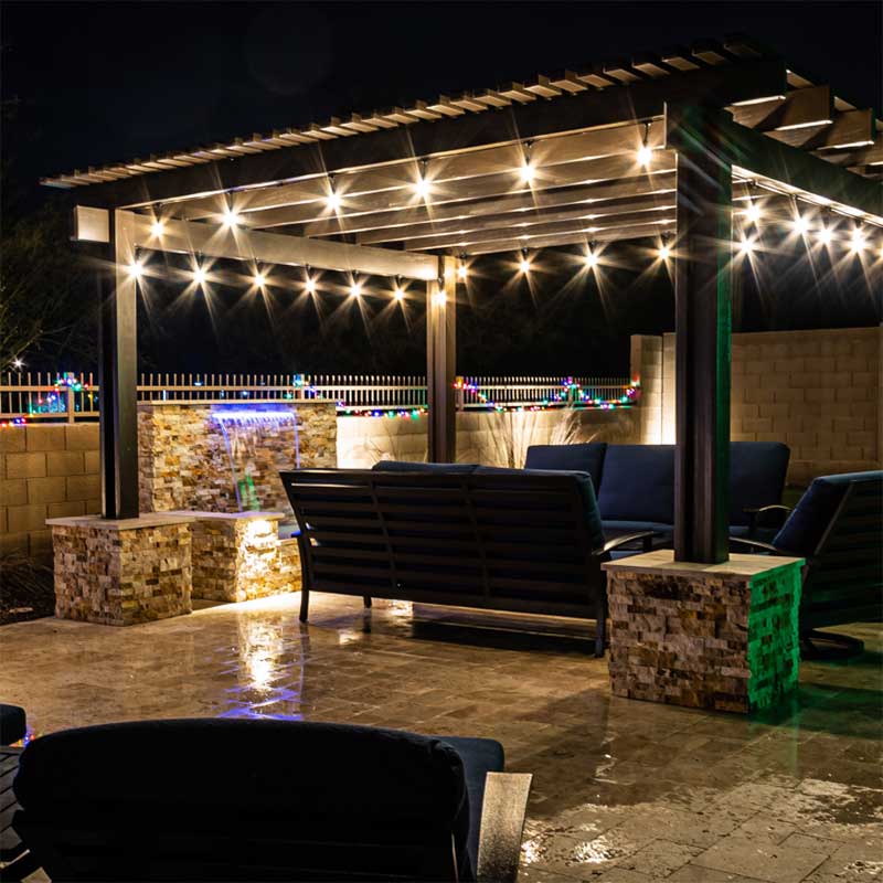 outdoor pergola at night with string lights