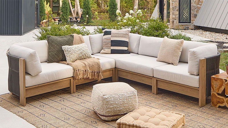 outdoor sectional sofa on outdoor rug with ottoman
