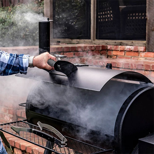 food cooking on an open traditional offset smoker