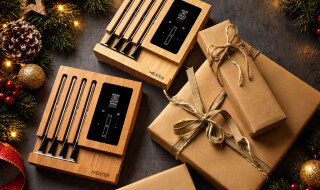 Gift-wrapped MEATER Pro XL box beside its four wireless probes and charging block