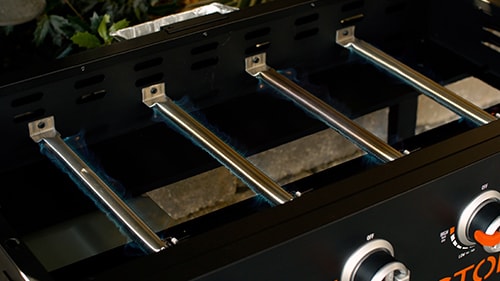 4 tube-style burners installed inside the Blackstone griddle